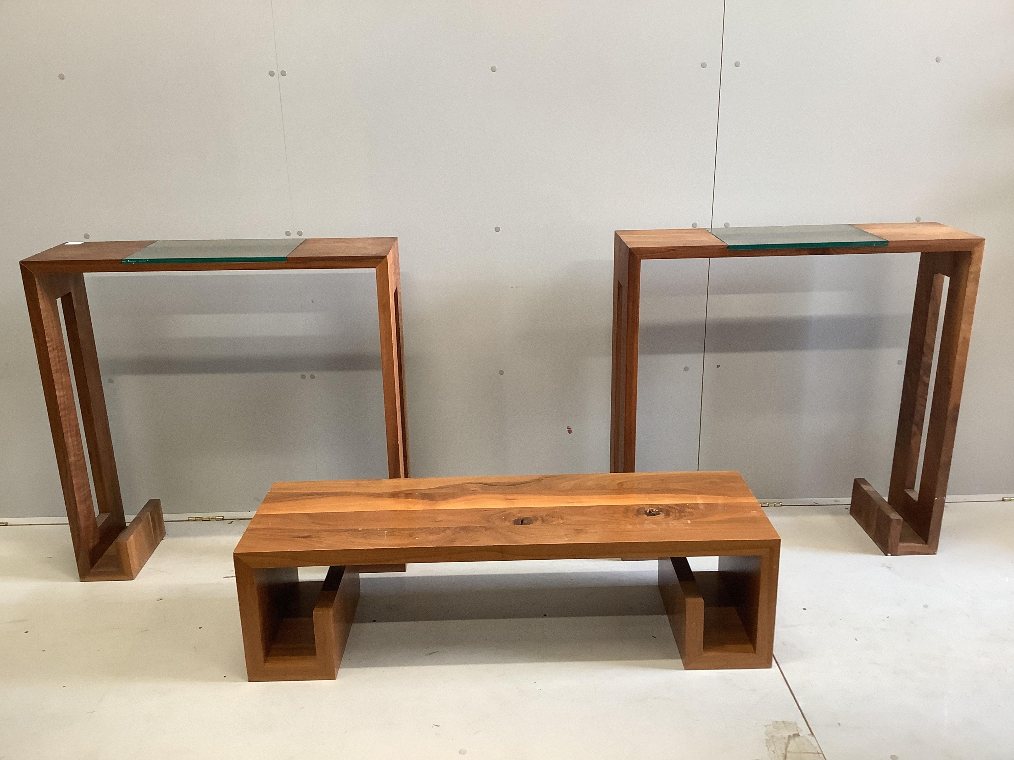 DFP Design, two solid walnut and glass console tables, width 89cm, depth 27cm, height 90cm, together with a coffee table. Condition - fair